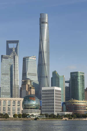 View Of Intersection Of Century Avenue And Lujiazui Ring Road In The Pudong  New District Of Shanghai, China. Skyscrapers Of Downtown On Blue Sky  Background. The Oriental Pearl Tower Is Visible At