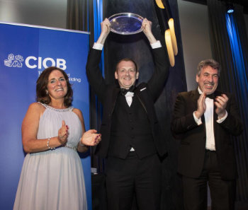 CIOB Awards 2022 David raising plate 350.jpg